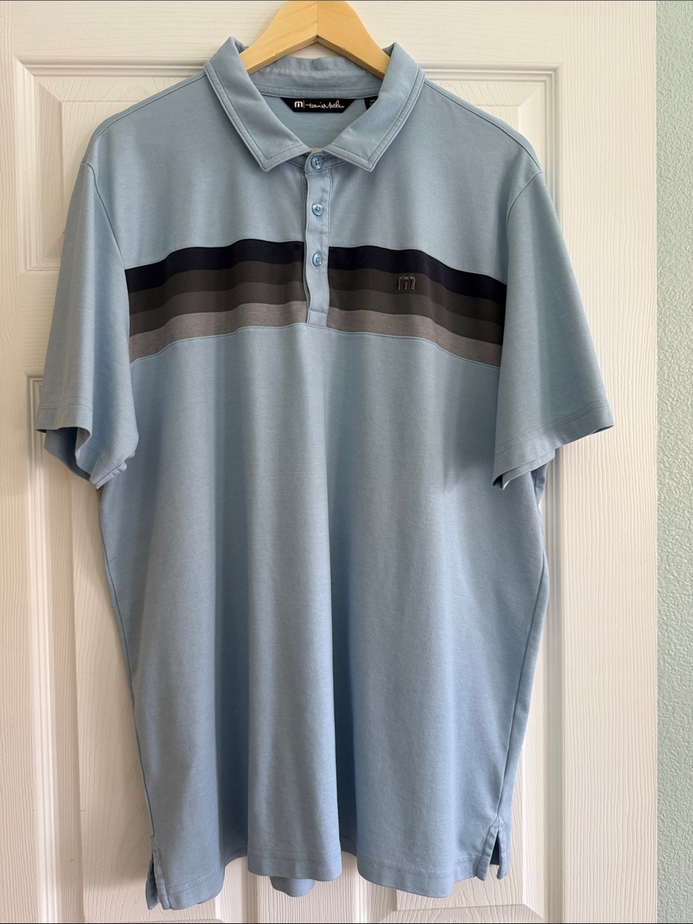Men’s Travis Mathew Light Blue Striped Polo Shirt